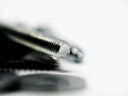 Close-up of various steel nuts and boltsの写真素材