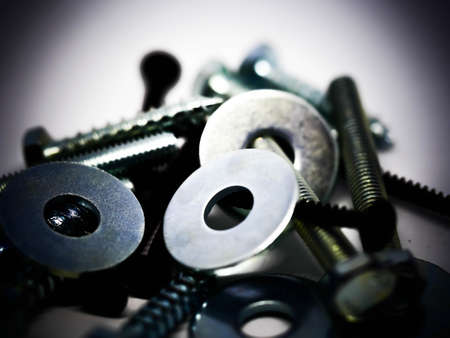 Close-up of various steel nuts and boltsの写真素材