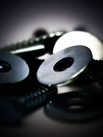 Close-up of various steel nuts and boltsの写真素材