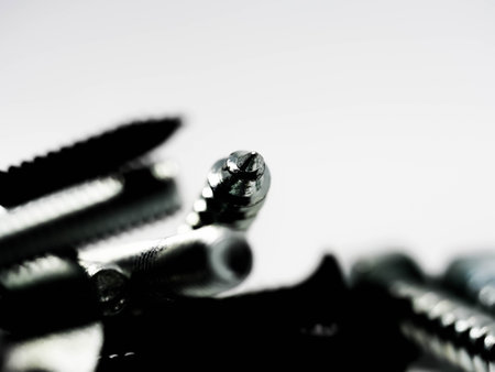 Close-up of various steel nuts and boltsの写真素材