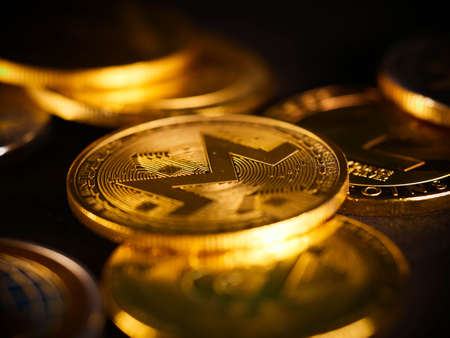 Crypto currency background with various of shiny silver and golden physical cryptocurrencies symbol coins, Bitcoin, Ethereum, Litecoin, zcash, ripple.の写真素材