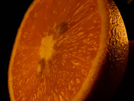 Closeup of fresh morning dew covered orange slices to eat for breakfastの写真素材