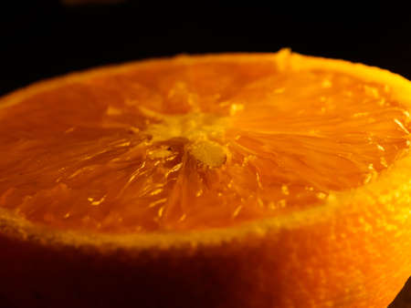 Closeup of fresh morning dew covered orange slices to eat for breakfastの写真素材