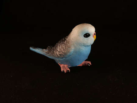 Toy figurines of owl and parrots different shapes and sizes