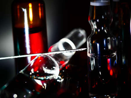 Medical ampoules close up. Many ampoules. Glass ampoules on the table. Scattered ampoules with medicine.の写真素材