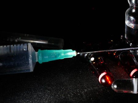 Medical ampoules close up. Many ampoules. Glass ampoules on the table. Scattered ampoules with medicine.の写真素材