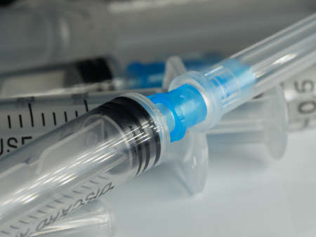 Several syringe on white table prepared for injection in hospital, selective focus, DOF, macroの写真素材