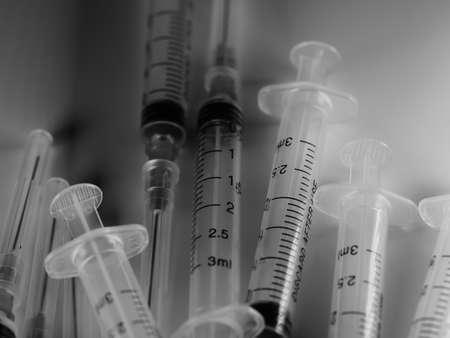 Several syringe on white table prepared for injection in hospital, selective focus, DOF, macroの写真素材