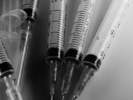 Several syringe on white table prepared for injection in hospital, selective focus, DOF, macroの写真素材