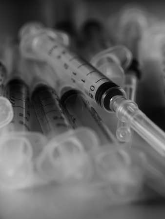 Several syringe on white table prepared for injection in hospital, selective focus, DOF, macroの写真素材