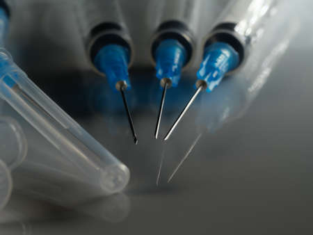 Several syringe on white table prepared for injection in hospital, selective focus, DOF, macroの写真素材
