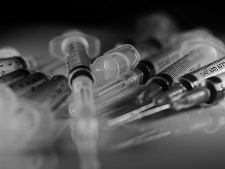 Several syringe on white table prepared for injection in hospital, selective focus, DOF, macroの写真素材