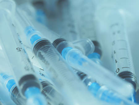 Several syringe on white table prepared for injection in hospital, selective focus, DOF, macroの写真素材