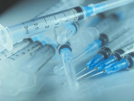 Several syringe on white table prepared for injection in hospital, selective focus, DOF, macroの写真素材