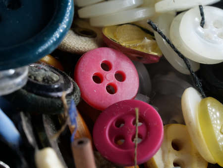 Collection of assorted spare clothes buttons. Macro. DOF