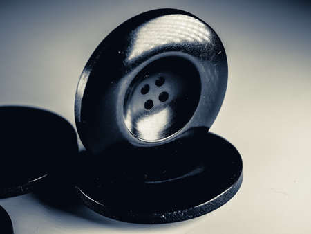 Grayscale photo of buttons. Collection of assorted spare clothes buttons. Macro. DOFの写真素材