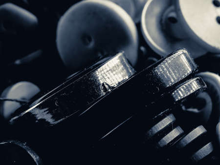 Grayscale photo of buttons. Collection of assorted spare clothes buttons. Macro. DOFの写真素材