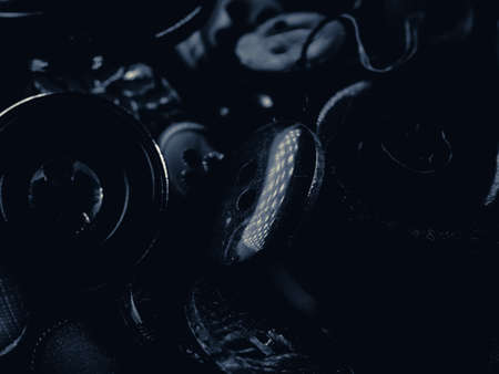 Grayscale photo of buttons. Collection of assorted spare clothes buttons. Macro. DOFの写真素材