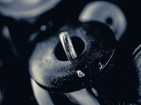Grayscale photo of buttons. Collection of assorted spare clothes buttons. Macro. DOFの写真素材