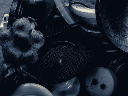 Grayscale photo of buttons. Collection of assorted spare clothes buttons. Macro. DOFの写真素材