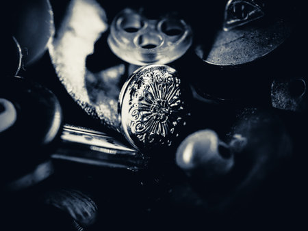 Grayscale photo of buttons. Collection of assorted spare clothes buttons. Macro. DOF