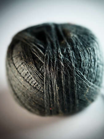 Ball of yarn on white background. Selective focus. Macro.