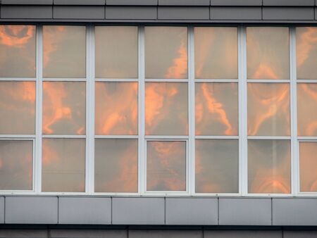 office facade with windows at dawn. stock photo