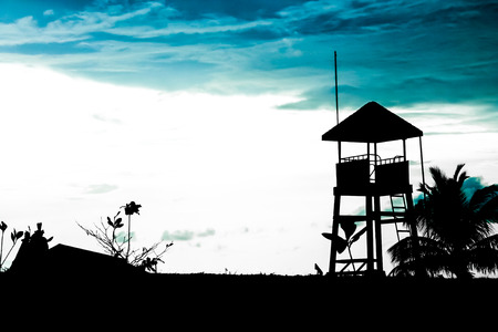 Silhouette of a lifeguard tower at beach in Thailandの写真素材
