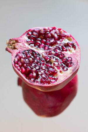 Closeup of a Pomegranate fruit cut in halfの写真素材