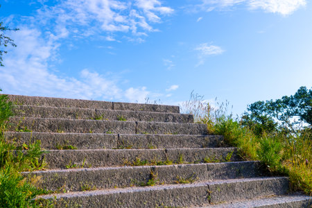 Old stone stairs leading to sky outdoors in middle of nature on summer day