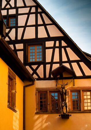 Traditional timber frame and stucco house in Riquewihr, , Alsace, Franceの写真素材