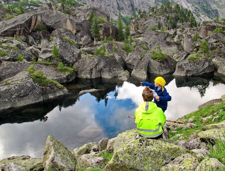 Mountain lake with reflection in park Ergaki, Russia