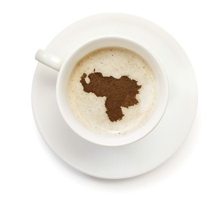 A cup of coffee with foam and powder in the shape of Venezuela.(series)の写真素材