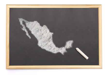 Blackboard with a chalk and the shape of Mexico drawn onto. (series)の写真素材