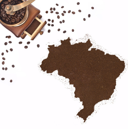 Coffee powder in the shape of Brazil and a decorative coffee mill.(series)の写真素材