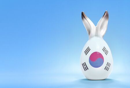 Colorful cute ceramic easter egg with rabbit ears and the flag of South Korea .(series)の写真素材