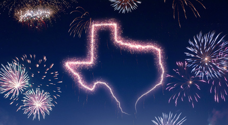 A dark night sky with a sparkling red firecracker in the shape of Texas composed into.(series)の写真素材