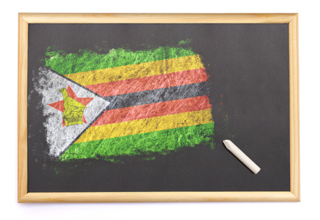 Blackboard with the national flag of Zimbabwe drawn on and a chalk.(series)の写真素材