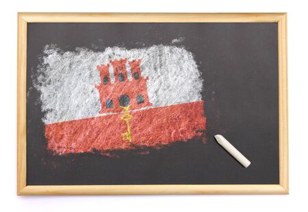 Blackboard with the national flag of Gibraltar drawn on and a chalk.(series)の写真素材