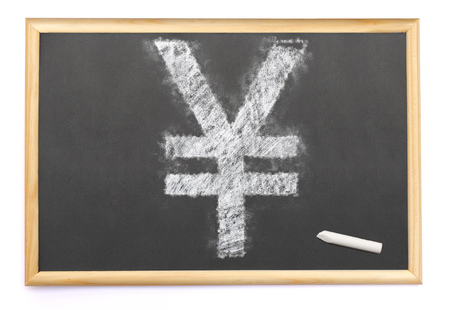 Blackboard with a Yen or Yuan symbol drawn on and a single chalk.(series)の写真素材