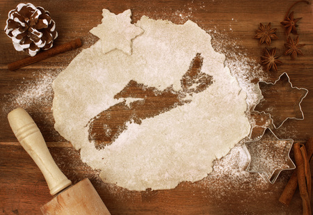 Festive cookie dough with the shape of Nova Scotia cut out (series)の写真素材
