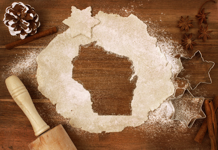 Festive cookie dough with the shape of Wisconsin cut out (series)の写真素材