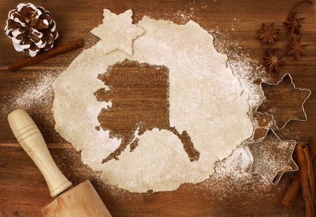 Festive cookie dough with the shape of Alaska cut out (series)の写真素材