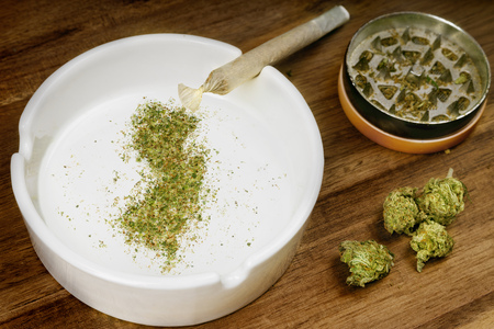 Crumbled weed in the shape of New Jersey and a joint.の写真素材