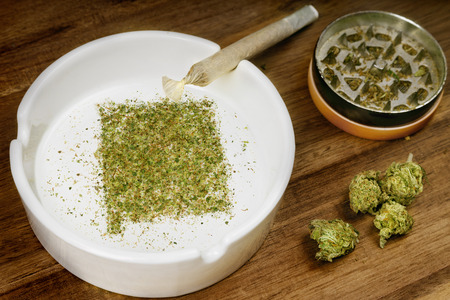 Crumbled weed in the shape of New Mexico and a joint.の写真素材