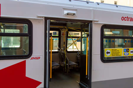 OTTAWA, ONTARIO, CANADA - MAY 9, 2020: A sign on an OC Transpo bus directs riders to its rear door,...