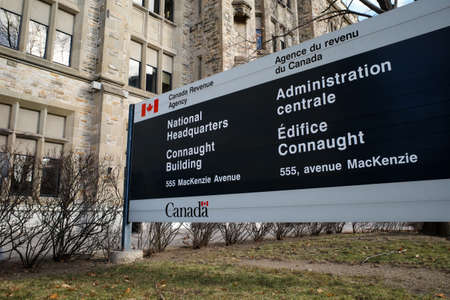 Ottawa, Ontario, Canada - November 18, 2020: A sign for the National Headquarters of the Canada Revenue Agency (CRA) outside the Connaught Building in Ottawa.のeditorial素材