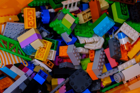 Ottawa, Ontario, Canada - January 7, 2021: An orange bin contains bricks and other pieces from LEGO building toys.のeditorial素材
