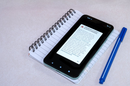 Ottawa, Ontario, Canada - January 14, 2021: A bilingual emergency alert broadcast to wireless devices through the Alert Ready system in Ontario is displayed on an Android smartphone.のeditorial素材