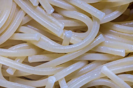 A close-up image of cooked spaghetti noodles show the texture of the pasta.の写真素材